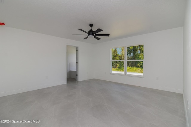 963 Sareta St SE, Palm Bay, FL 32909 - unfurnished room featuring ceiling fan and baseboards