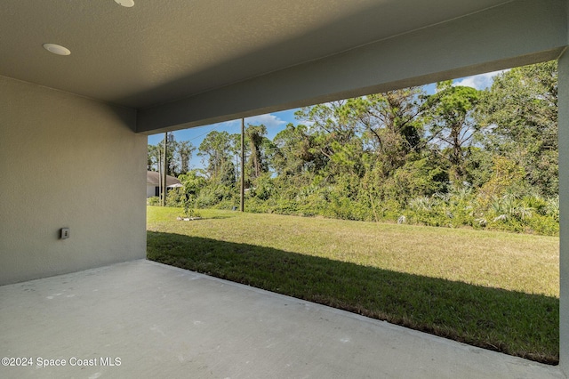 963 Sareta St SE, Palm Bay, FL 32909 - view of patio / terrace featuring view of scattered trees