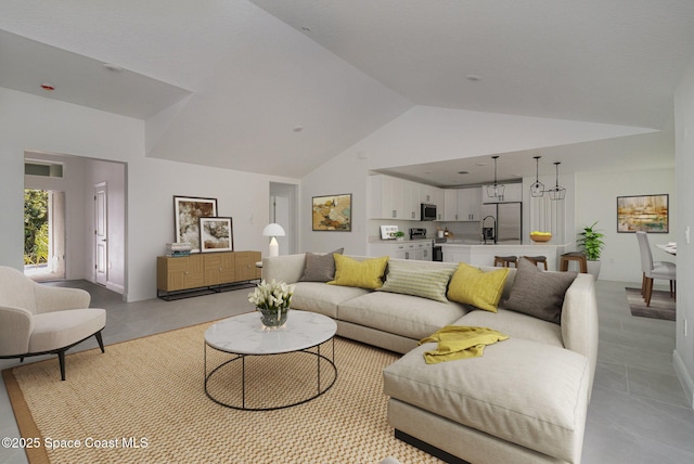 living area with visible vents and high vaulted ceiling