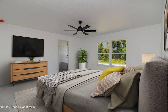 bedroom with baseboards, concrete floors, and ceiling fan