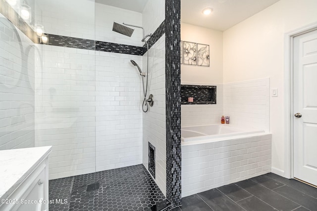 bathroom featuring tile patterned flooring, vanity, and independent shower and bath