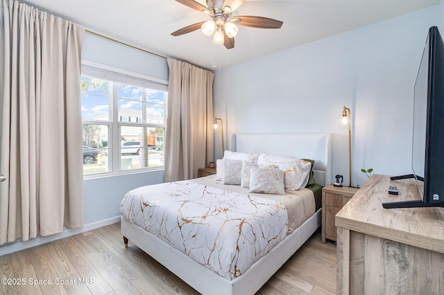 bedroom featuring ceiling fan and light wood-type flooring