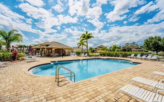 view of pool featuring a patio