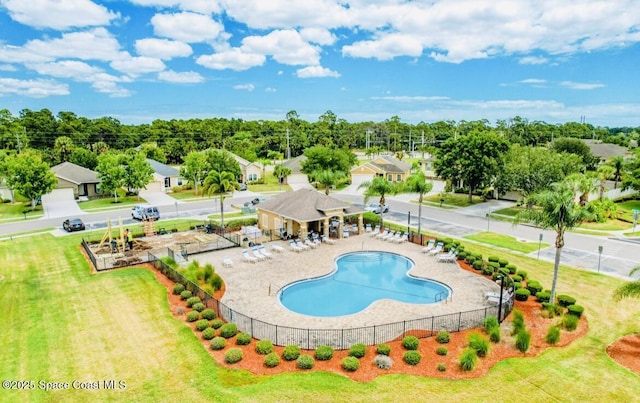 view of swimming pool with a yard and a patio area