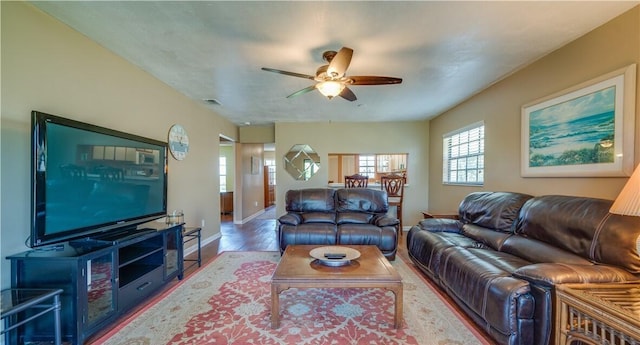 living room with ceiling fan and hardwood / wood-style floors