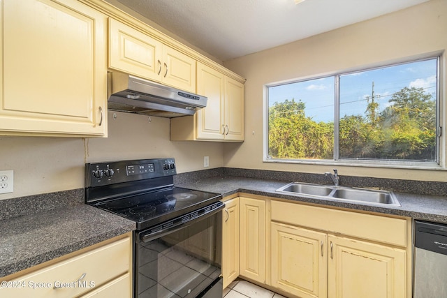 kitchen with stainless steel dishwasher, light tile patterned floors, sink, and black range with electric cooktop