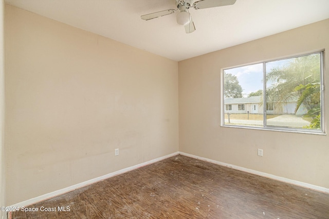 spare room with ceiling fan and hardwood / wood-style floors