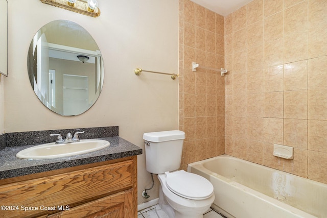 full bathroom featuring vanity, toilet, and tiled shower / bath