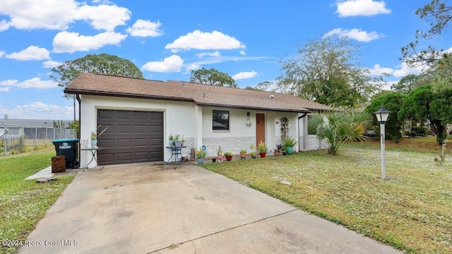 view of front of house with a front lawn and a garage