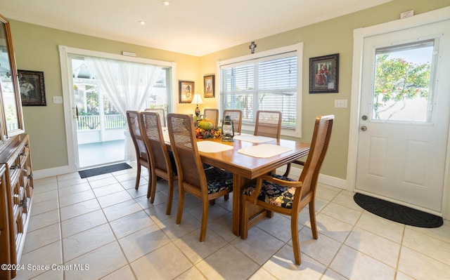 tiled dining room with ornamental molding