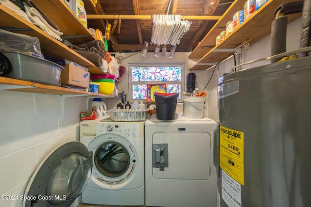 laundry area with washing machine and dryer and water heater