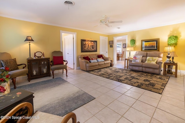 tiled living room featuring ceiling fan and ornamental molding