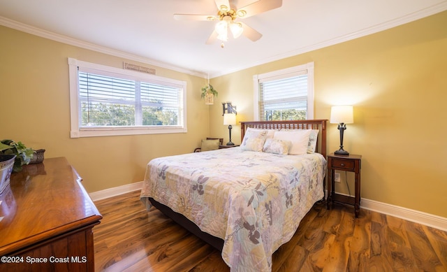 bedroom featuring multiple windows, ceiling fan, and dark wood-type flooring