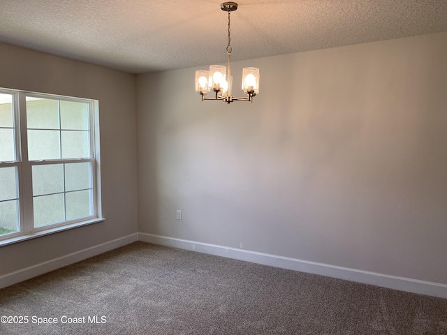 698 De Groodt Rd SW, Palm Bay, FL 32908 - empty room with a chandelier, carpet, and a textured ceiling