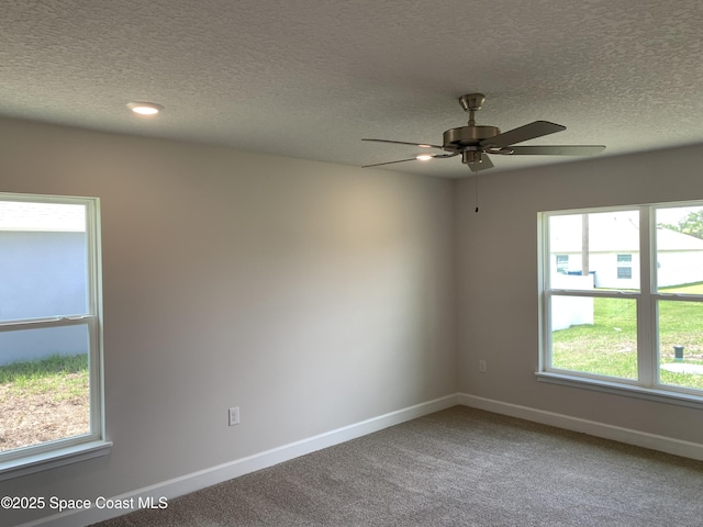 698 De Groodt Rd SW, Palm Bay, FL 32908 - carpeted spare room featuring a textured ceiling and a ceiling fan