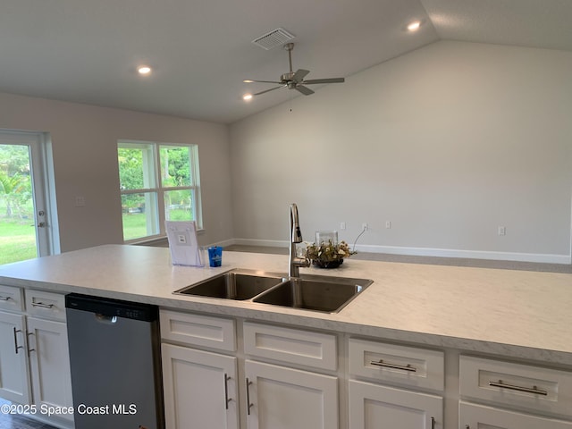 698 De Groodt Rd SW, Palm Bay, FL 32908 - kitchen featuring stainless steel dishwasher, lofted ceiling, light countertops, white cabinets, and ceiling fan
