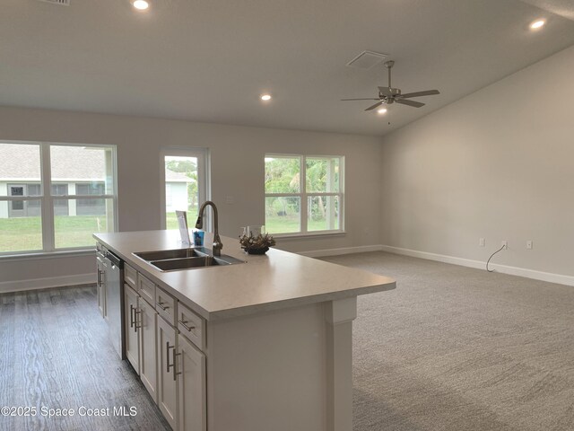 698 De Groodt Rd SW, Palm Bay, FL 32908 - kitchen featuring ceiling fan, stainless steel dishwasher, light countertops, recessed lighting, and a kitchen island with sink