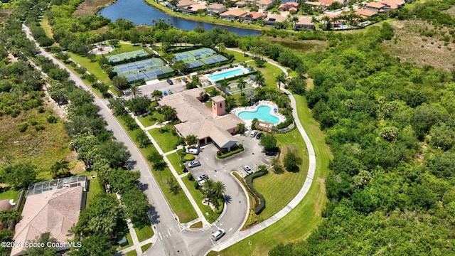 birds eye view of property with a water view