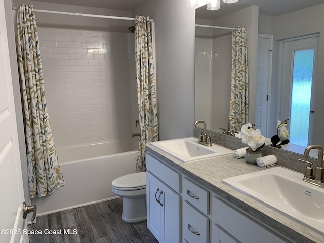 439 Wellwood St SW, Palm Bay, FL 32908 - full bath with shower / bath combo, double vanity, and wood finished floors