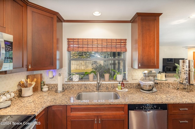 kitchen with light stone countertops, backsplash, stainless steel appliances, ceiling fan, and sink