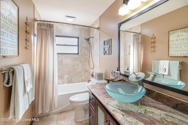 full bathroom featuring tile patterned flooring, vanity, shower / tub combo, and toilet