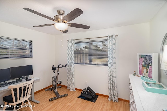 office with ceiling fan and hardwood / wood-style flooring