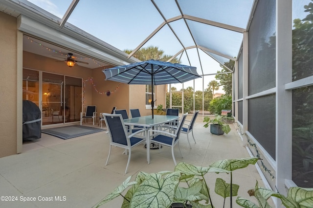 view of patio / terrace featuring a lanai