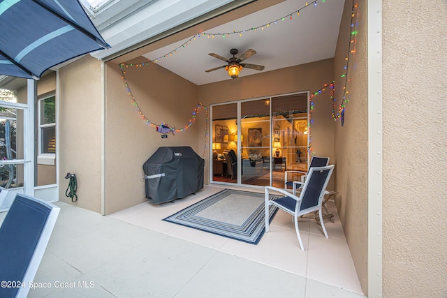 view of patio with ceiling fan and area for grilling