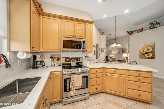 kitchen featuring kitchen peninsula, backsplash, stainless steel appliances, sink, and light tile patterned flooring