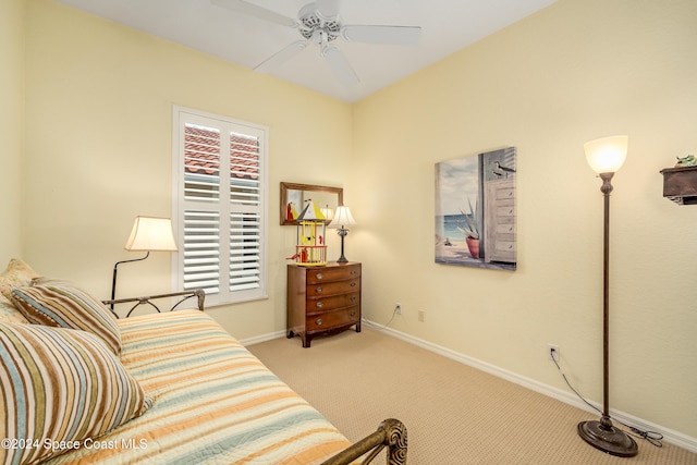 bedroom with light carpet and ceiling fan