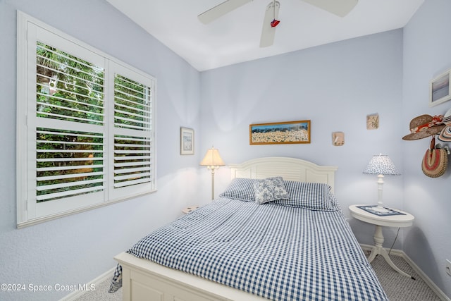 bedroom with ceiling fan and carpet