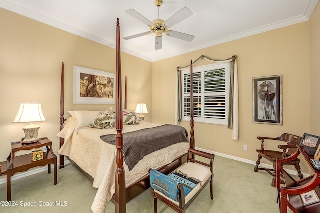 bedroom featuring ceiling fan, ornamental molding, and light carpet