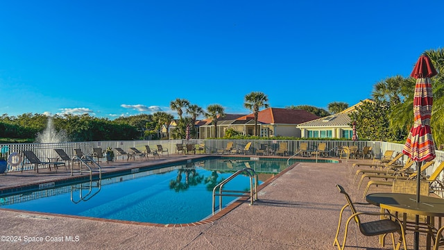 view of swimming pool with a patio