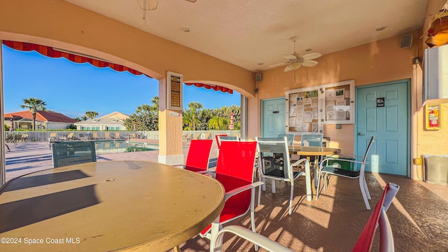 view of patio featuring ceiling fan