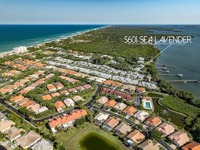 5601 Sea Lavender Pl, Melbourne Beach, FL 32951 - aerial overview of property's location with a large body of water and nearby suburban area
