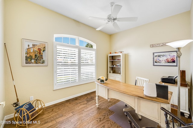 5601 Sea Lavender Pl, Melbourne Beach, FL 32951 - office with wood finished floors, baseboards, and a ceiling fan