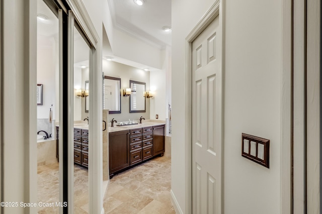 5601 Sea Lavender Pl, Melbourne Beach, FL 32951 - full bathroom with double vanity, crown molding, and a garden tub