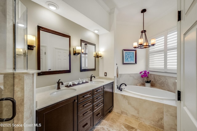 5601 Sea Lavender Pl, Melbourne Beach, FL 32951 - bathroom with crown molding, a chandelier, a bath, and double vanity