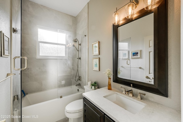 5601 Sea Lavender Pl, Melbourne Beach, FL 32951 - bathroom featuring toilet, vanity, and bath / shower combo with glass door