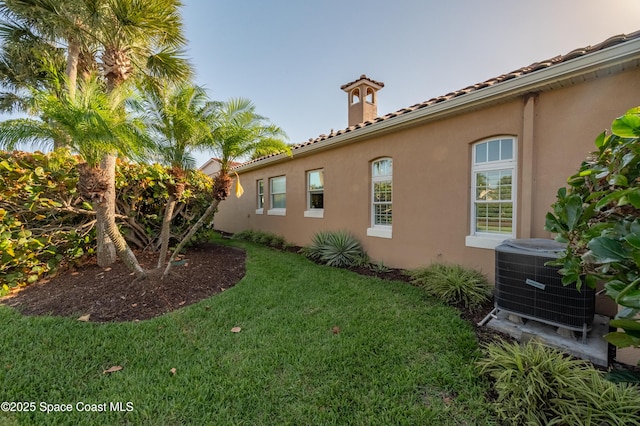 5601 Sea Lavender Pl, Melbourne Beach, FL 32951 - view of green lawn with cooling unit