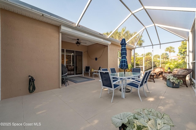 5601 Sea Lavender Pl, Melbourne Beach, FL 32951 - view of patio with ceiling fan, outdoor dining area, and a lanai