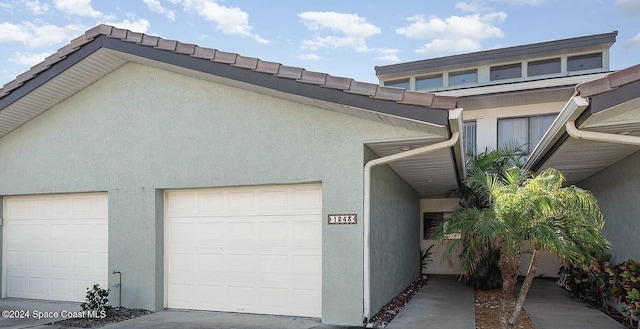 view of side of property with a garage