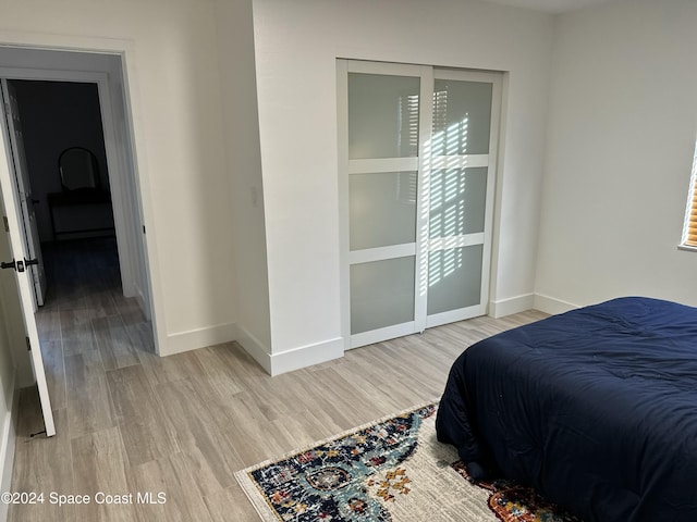 bedroom with light hardwood / wood-style flooring