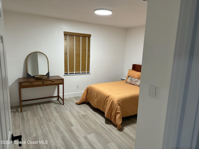 bedroom with light hardwood / wood-style flooring