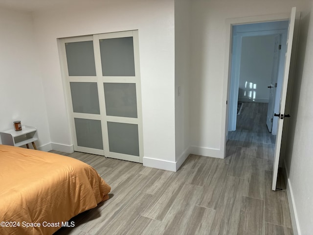 bedroom with light hardwood / wood-style floors