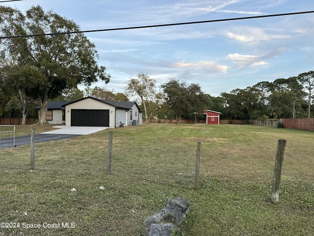 view of front of property featuring a garage and a front yard