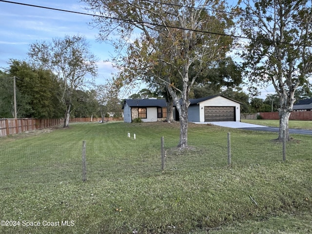 view of front of house with a front lawn and a garage