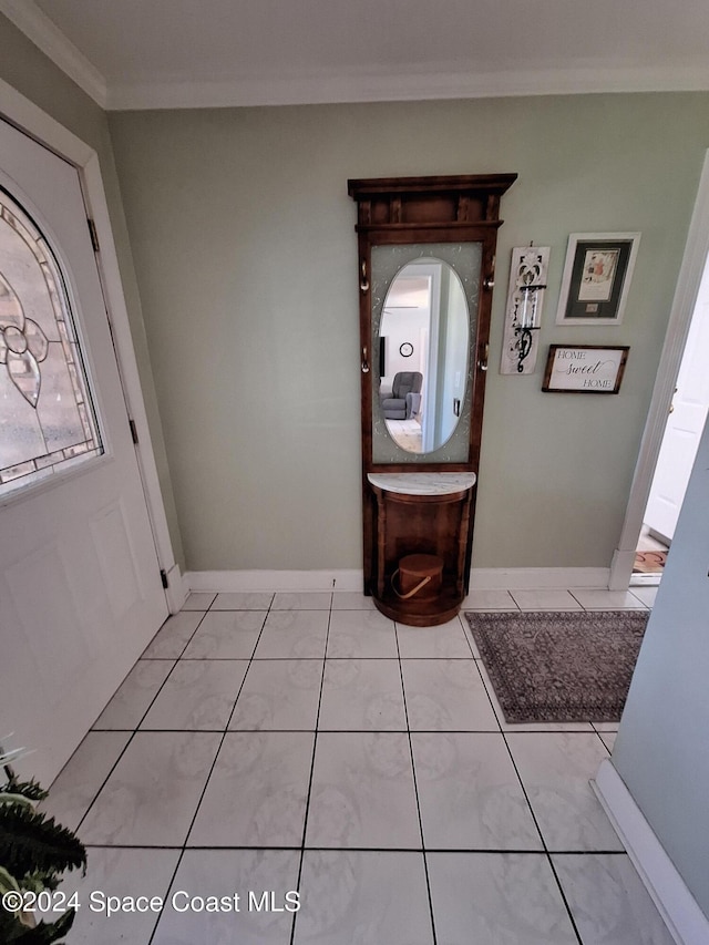 tiled entryway with crown molding