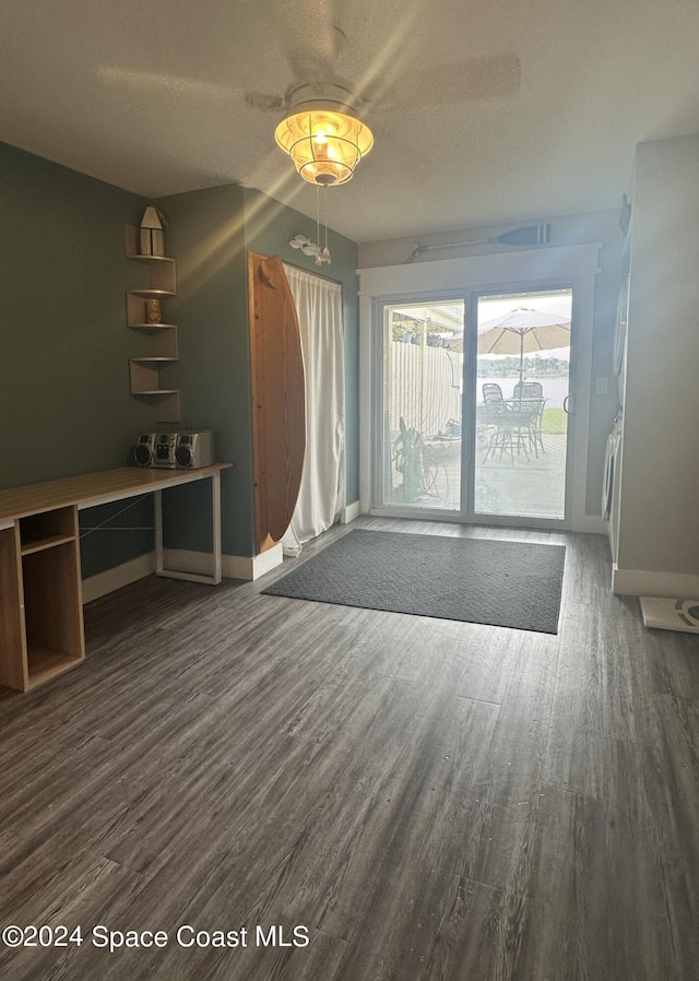 empty room with dark wood-type flooring