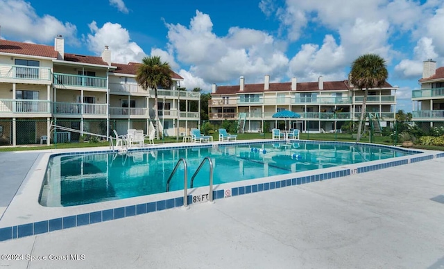 view of swimming pool featuring a patio area